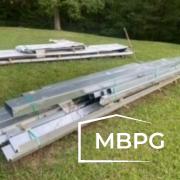 Steel Materials Laying in Grass